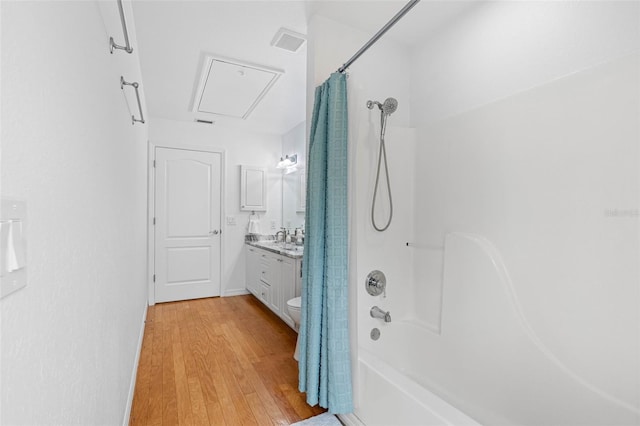 full bathroom featuring shower / bath combination with curtain, wood-type flooring, toilet, and vanity