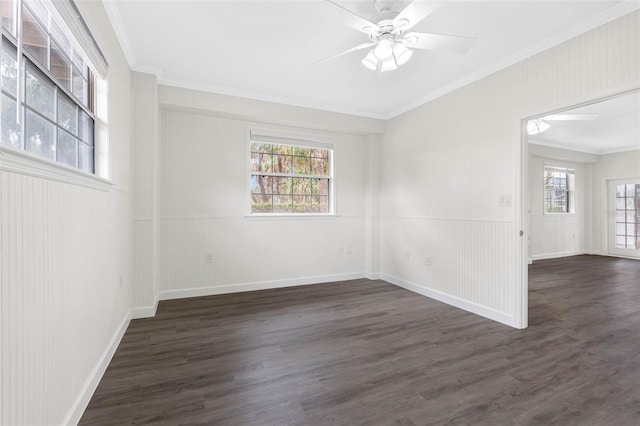 unfurnished room featuring crown molding, dark wood-type flooring, and a healthy amount of sunlight