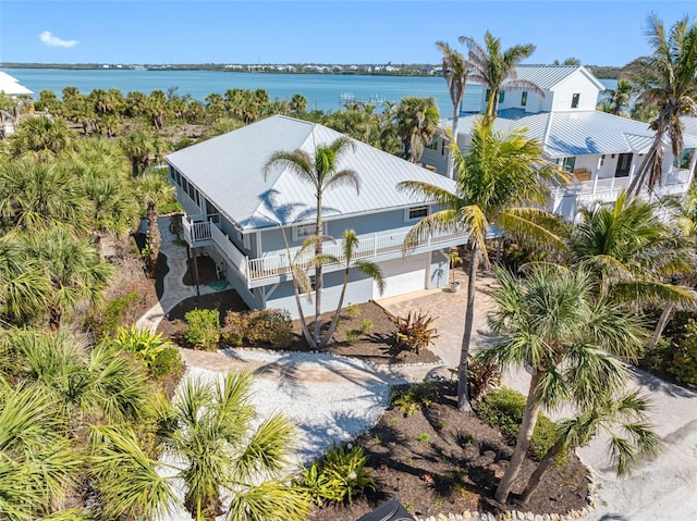 birds eye view of property with a water view