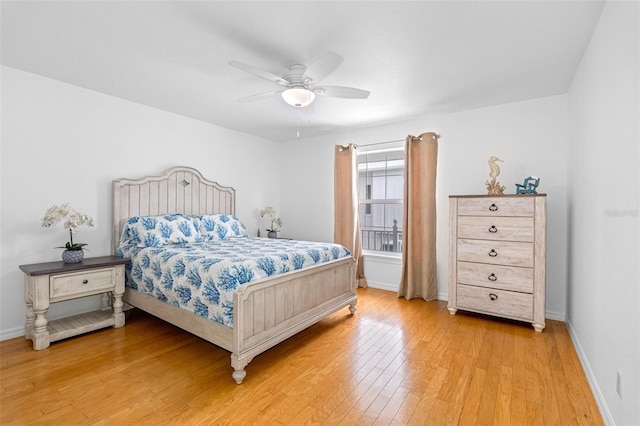 bedroom featuring light wood-type flooring, ceiling fan, and baseboards