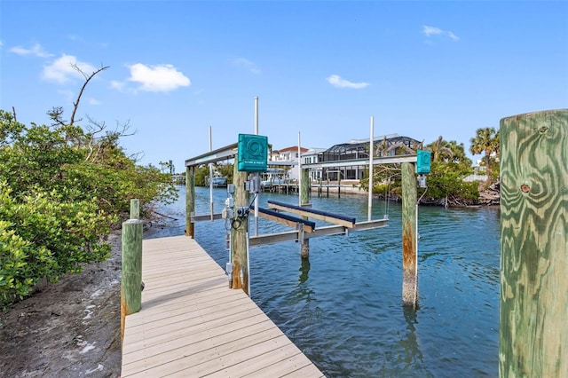 dock area featuring a water view and boat lift