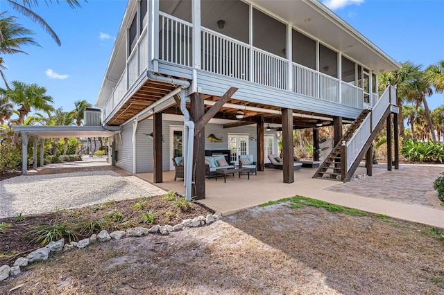 exterior space featuring ceiling fan, stairway, and a sunroom