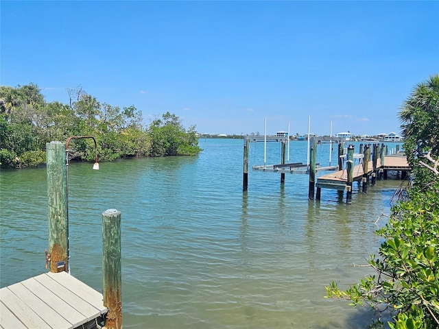 79 Palm Dr, Placida, FL 33946 - dock area featuring boat lift and a water view