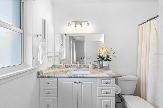79 Palm Dr, Placida, FL 33946 - bathroom with toilet and vanity