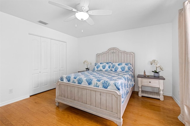 79 Palm Dr, Placida, FL 33946 - bedroom featuring a closet, ceiling fan, visible vents, baseboards, and wood finished floors