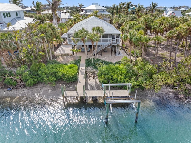 79 Palm Dr, Placida, FL 33946 - dock area featuring stairway, a patio, boat lift, and a water view