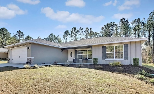 ranch-style home with a front yard, a garage, and cooling unit