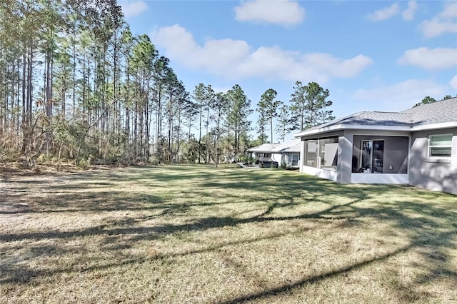 view of yard with a sunroom