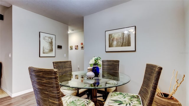 dining space featuring light hardwood / wood-style flooring