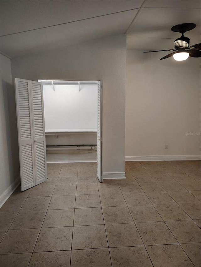 interior space with ceiling fan and light tile patterned floors