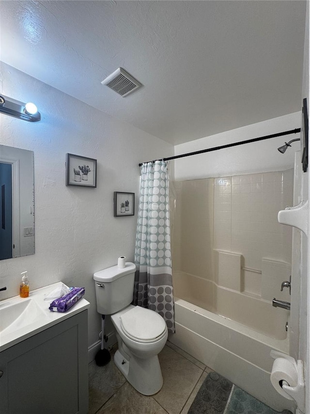 full bathroom with shower / bath combination with curtain, vanity, a textured ceiling, tile patterned flooring, and toilet