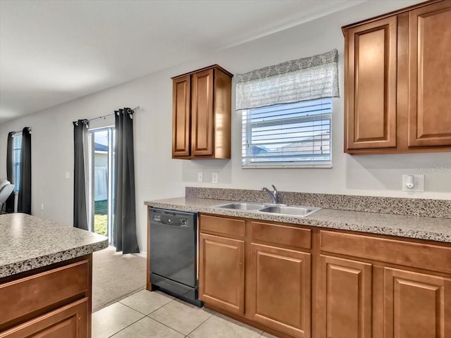 kitchen with dishwasher, light tile patterned floors, and sink