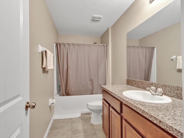 full bathroom featuring shower / bath combo, tile patterned floors, a textured ceiling, toilet, and vanity