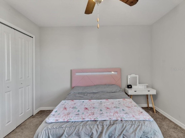 carpeted bedroom with a closet and ceiling fan