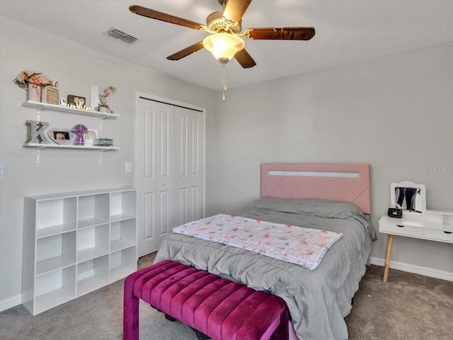 bedroom with carpet flooring, a closet, and ceiling fan