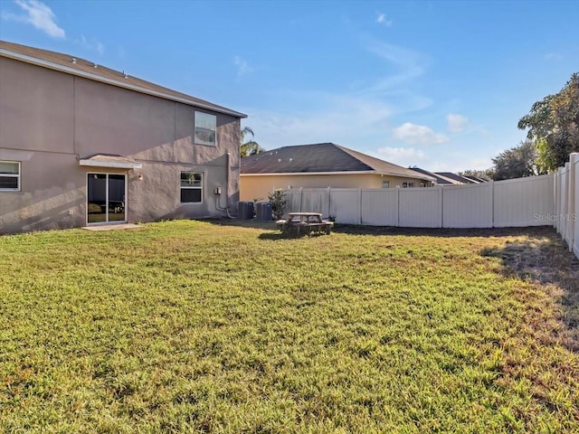 view of yard with central AC