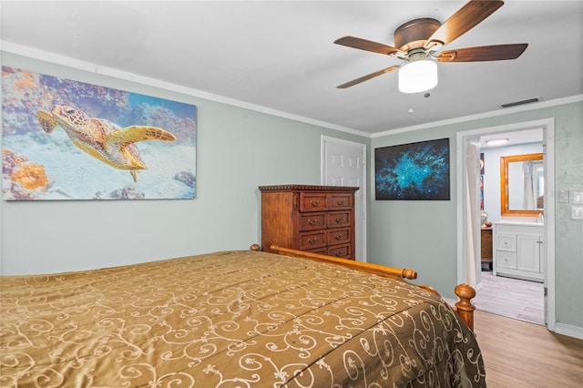 bedroom with wood-type flooring, ensuite bathroom, ceiling fan, and ornamental molding