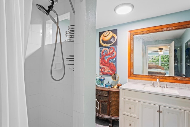 bathroom featuring vanity and a shower