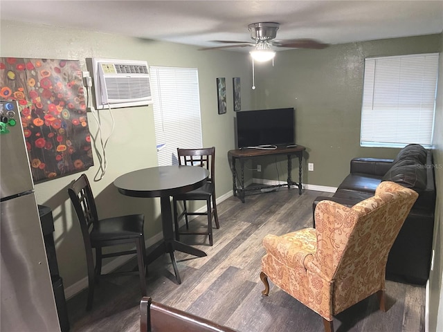 living room featuring an AC wall unit, ceiling fan, and hardwood / wood-style flooring