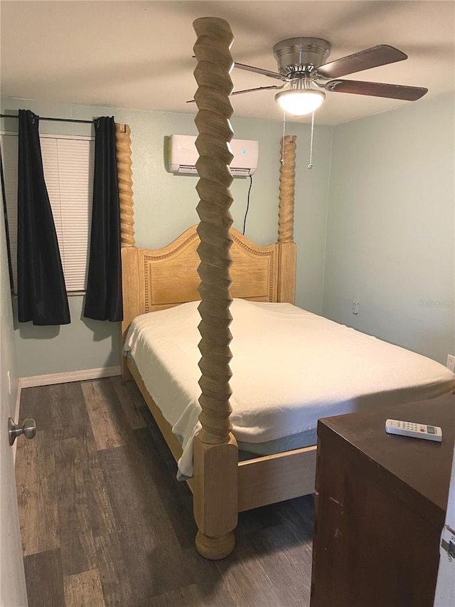 bedroom with a wall mounted air conditioner, ceiling fan, and dark wood-type flooring