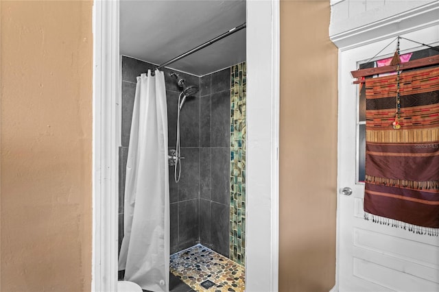 bathroom with a shower with shower curtain