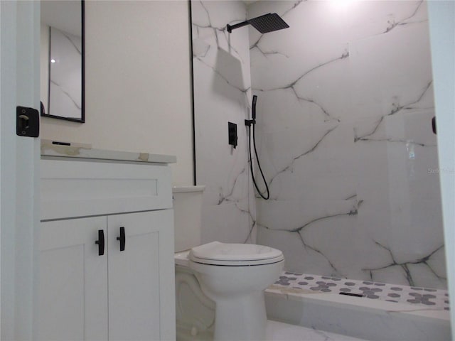 bathroom with vanity, toilet, and walk in shower