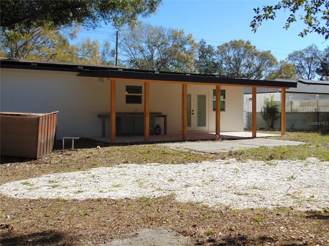 back of property featuring a patio