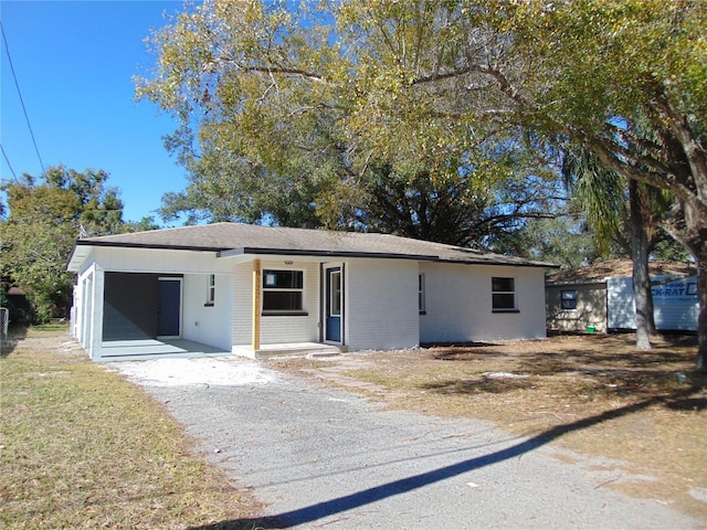 ranch-style house with a carport