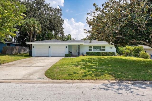 ranch-style house featuring a garage and a front yard