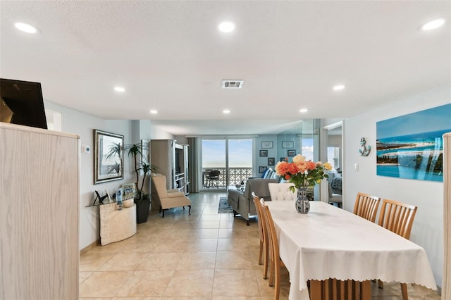 dining room with a wall of windows