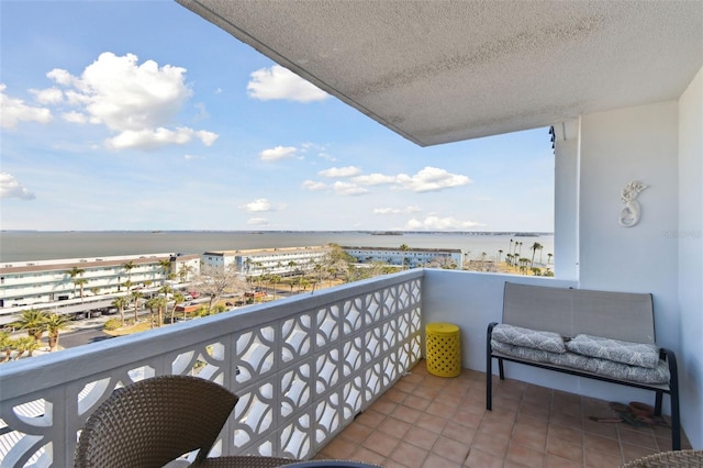 balcony featuring a water view