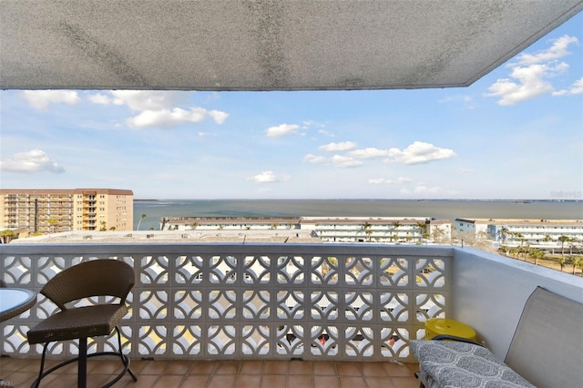 balcony featuring a water view