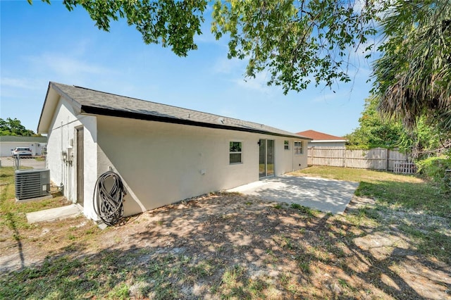 back of property featuring a patio area and central AC