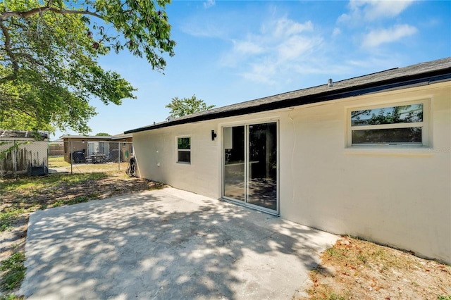 back of property with a patio area