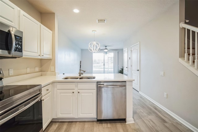 kitchen featuring white cabinets, ceiling fan, sink, and appliances with stainless steel finishes