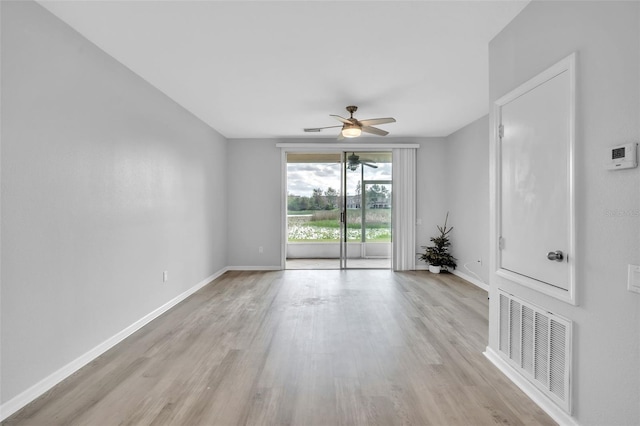 unfurnished room with ceiling fan and light hardwood / wood-style floors