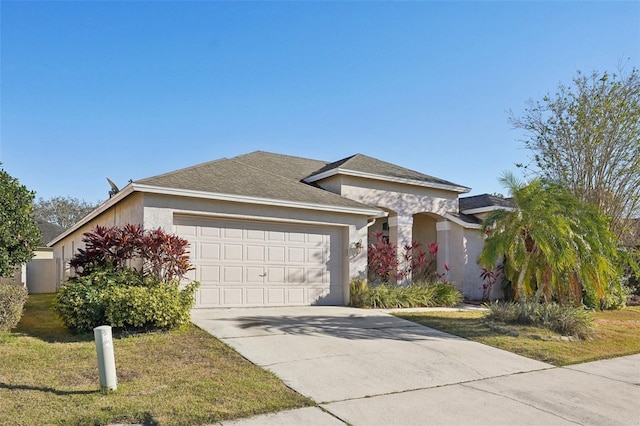 ranch-style home featuring a garage and a front yard