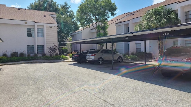 view of parking / parking lot with a carport