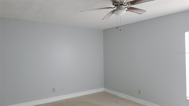 spare room with ceiling fan and a textured ceiling