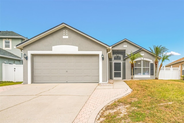 ranch-style house with a front lawn and a garage