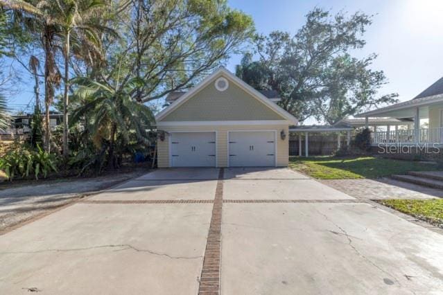 garage featuring a lawn