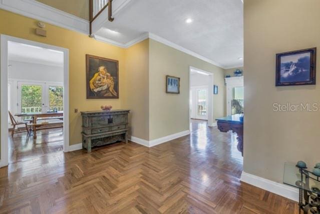 corridor with parquet flooring and ornamental molding