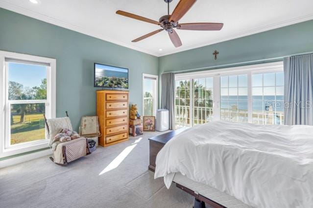 bedroom with carpet, access to exterior, ceiling fan, and crown molding