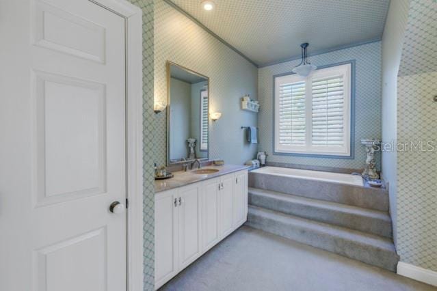 bathroom featuring vanity and separate shower and tub