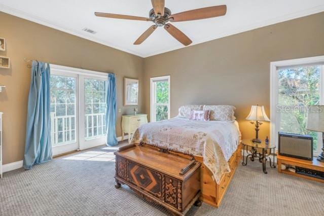 carpeted bedroom featuring access to exterior and ceiling fan