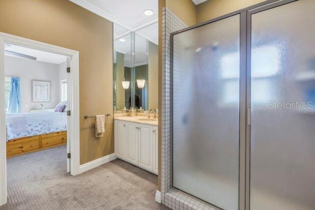 bathroom featuring vanity and an enclosed shower