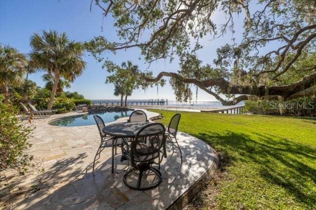 view of patio with a water view