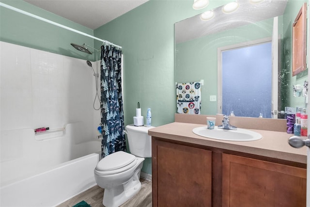 bathroom featuring wood finished floors, toilet, vanity, and shower / bathtub combination with curtain