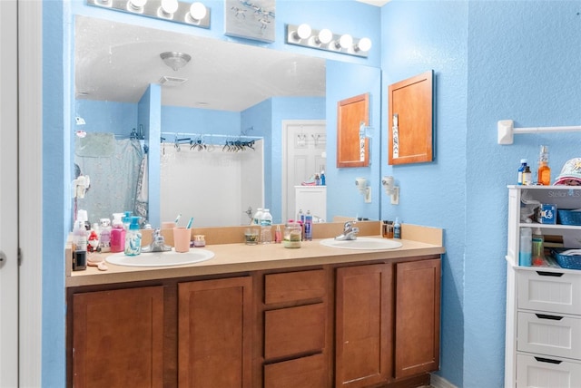 full bath with double vanity, visible vents, a shower with curtain, and a sink