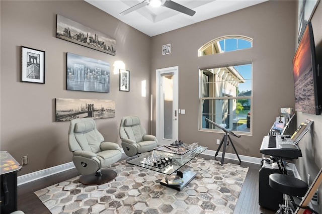 sitting room with hardwood / wood-style flooring and ceiling fan